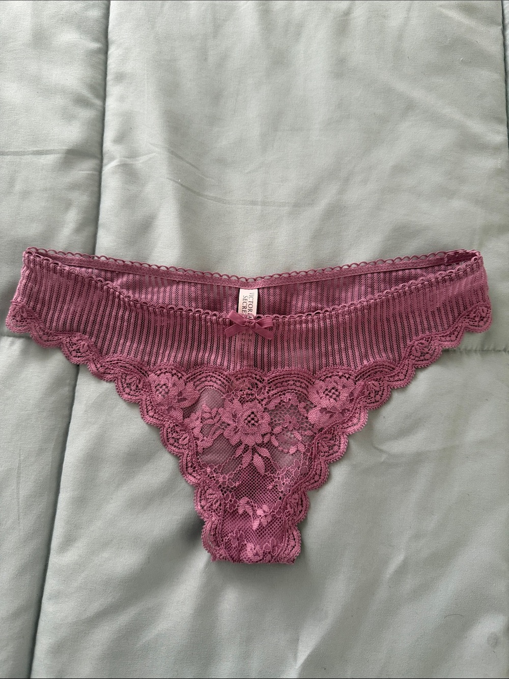 Victoria’s Secret size medium, dusty, pink lace thong